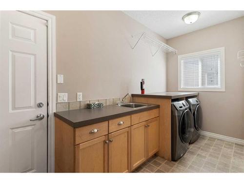 135 Kincora Drive Nw, Calgary, AB - Indoor Photo Showing Laundry Room