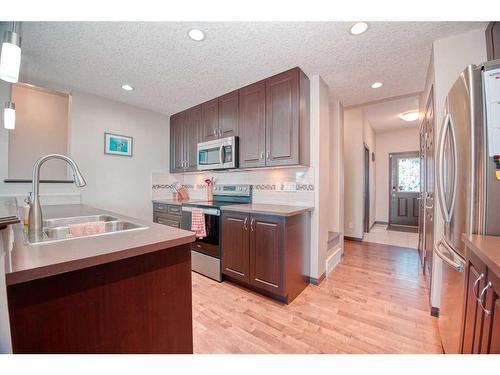 225 Auburn Crest Way Se, Calgary, AB - Indoor Photo Showing Kitchen With Double Sink