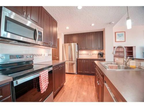 225 Auburn Crest Way Se, Calgary, AB - Indoor Photo Showing Kitchen With Double Sink With Upgraded Kitchen