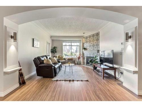 502-59 22 Avenue Sw, Calgary, AB - Indoor Photo Showing Living Room With Fireplace