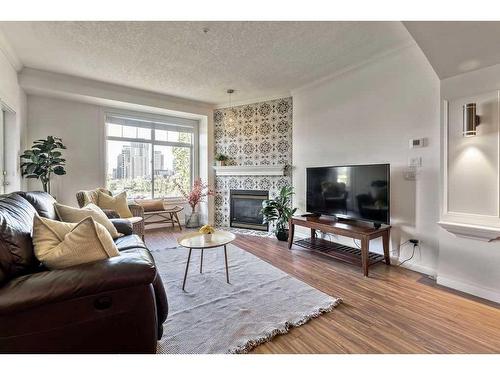 502-59 22 Avenue Sw, Calgary, AB - Indoor Photo Showing Living Room With Fireplace