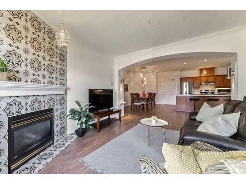 502-59 22 Avenue Sw, Calgary, AB - Indoor Photo Showing Living Room With Fireplace