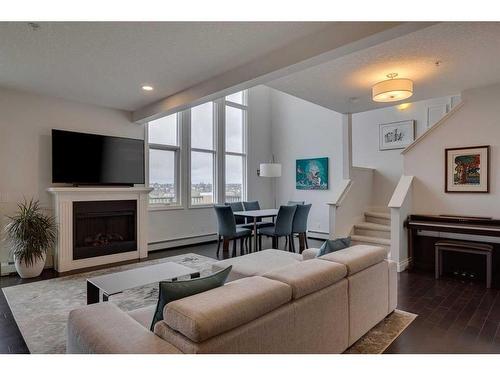 2307-10221 Tuscany Boulevard Nw, Calgary, AB - Indoor Photo Showing Living Room With Fireplace