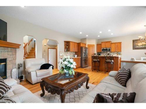 192 Eversyde Way Sw, Calgary, AB - Indoor Photo Showing Living Room With Fireplace