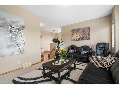 192 Eversyde Way Sw, Calgary, AB - Indoor Photo Showing Living Room