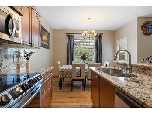 192 Eversyde Way Sw, Calgary, AB - Indoor Photo Showing Kitchen With Double Sink