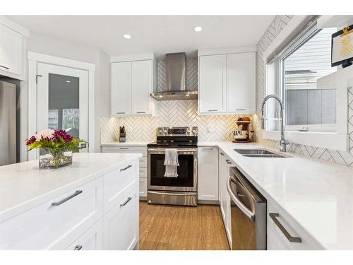 573 Douglas Woods Mews Se, Calgary, AB - Indoor Photo Showing Kitchen With Stainless Steel Kitchen With Double Sink With Upgraded Kitchen