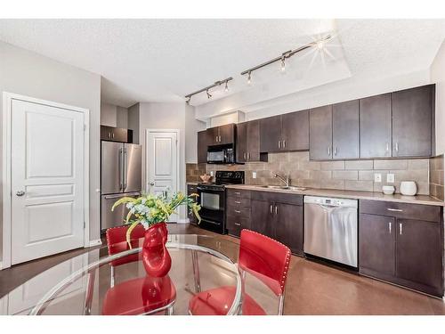 77-77 Auburn Bay Common Se, Calgary, AB - Indoor Photo Showing Kitchen With Double Sink