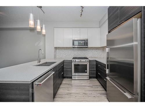 3322-95 Burma Star Road Sw, Calgary, AB - Indoor Photo Showing Kitchen With Stainless Steel Kitchen With Double Sink With Upgraded Kitchen