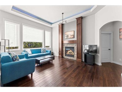 236 Aspenmere Close, Chestermere, AB - Indoor Photo Showing Living Room With Fireplace