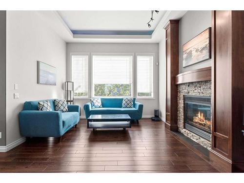 236 Aspenmere Close, Chestermere, AB - Indoor Photo Showing Living Room With Fireplace