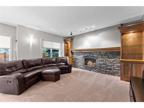 236 Aspenmere Close, Chestermere, AB - Indoor Photo Showing Living Room With Fireplace