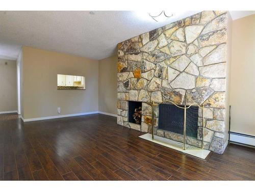 109-3719B 49 Street Nw, Calgary, AB - Indoor With Fireplace