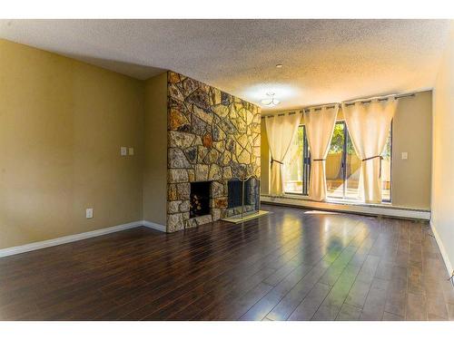 109-3719B 49 Street Nw, Calgary, AB - Indoor Photo Showing Other Room With Fireplace