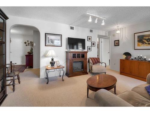 403-1001 14 Avenue Sw, Calgary, AB - Indoor Photo Showing Living Room With Fireplace