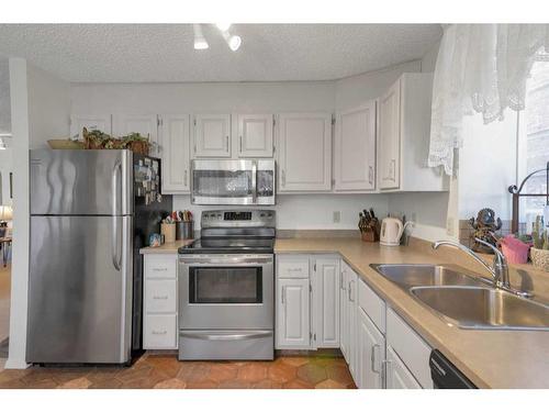 403-1001 14 Avenue Sw, Calgary, AB - Indoor Photo Showing Kitchen With Stainless Steel Kitchen With Double Sink