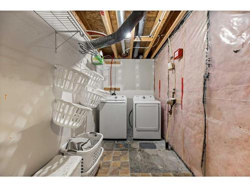 12 Mackenzie Way, Carstairs, AB - Indoor Photo Showing Laundry Room