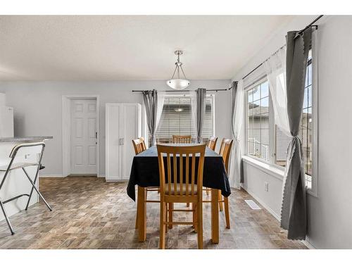 12 Mackenzie Way, Carstairs, AB - Indoor Photo Showing Dining Room