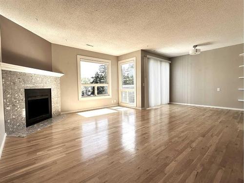 14-200 Shawnessy Drive Sw, Calgary, AB - Indoor Photo Showing Living Room With Fireplace