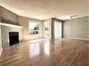 14-200 Shawnessy Drive Sw, Calgary, AB  - Indoor Photo Showing Living Room With Fireplace 