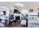 359-333 Riverfront Avenue Se, Calgary, AB  - Indoor Photo Showing Living Room With Fireplace 