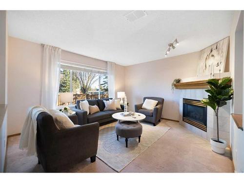 193 Citadel Circle Nw, Calgary, AB - Indoor Photo Showing Living Room With Fireplace