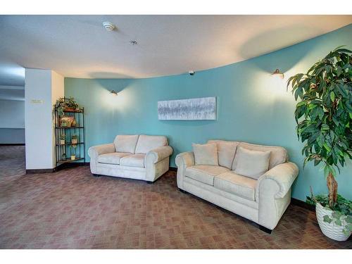 2202-2000 Millrise Point Sw, Calgary, AB - Indoor Photo Showing Living Room