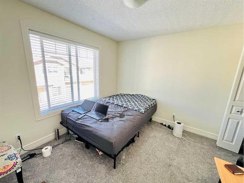 56 Bridleridge Manor  Sw, Calgary, AB - Indoor Photo Showing Bedroom