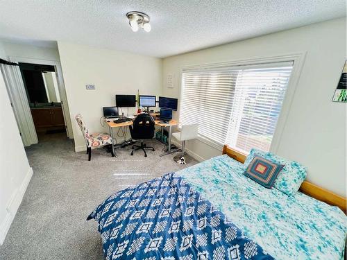 56 Bridleridge Manor  Sw, Calgary, AB - Indoor Photo Showing Bedroom