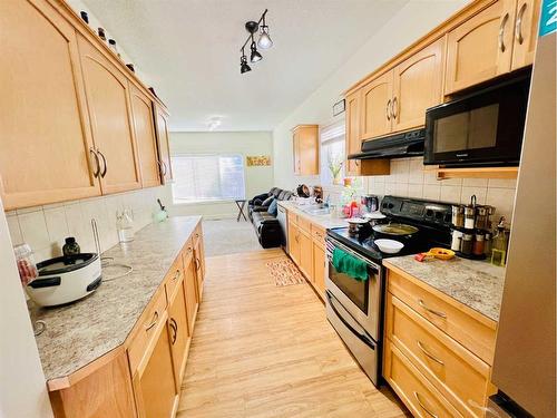 56 Bridleridge Manor  Sw, Calgary, AB - Indoor Photo Showing Kitchen