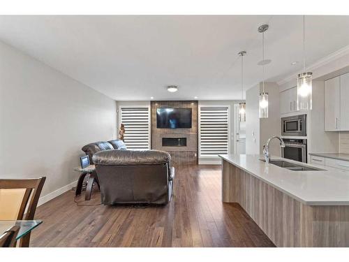 2807 36 Street Sw, Calgary, AB - Indoor Photo Showing Kitchen With Fireplace With Double Sink With Upgraded Kitchen