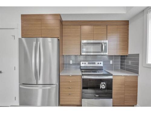 19625 45 Street Se, Calgary, AB - Indoor Photo Showing Kitchen With Stainless Steel Kitchen