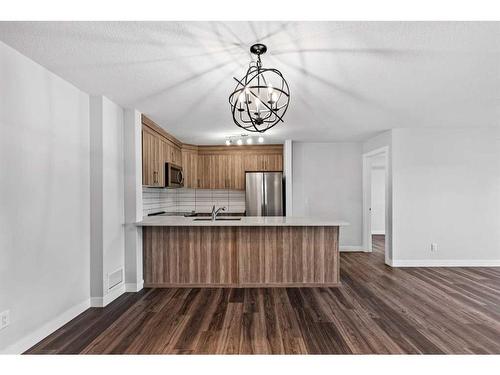 2110-6118 80 Avenue Ne, Calgary, AB - Indoor Photo Showing Kitchen With Double Sink