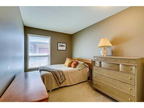 938 Suncastle Drive Se, Calgary, AB - Indoor Photo Showing Bedroom