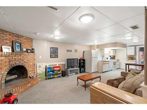 83 Alderwood Close Se, Calgary, AB - Indoor With Fireplace