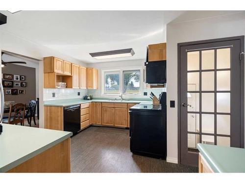 83 Alderwood Close Se, Calgary, AB - Indoor Photo Showing Kitchen With Double Sink