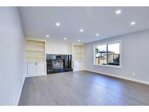 194 Woodbriar Circle Sw, Calgary, AB - Indoor Photo Showing Living Room With Fireplace