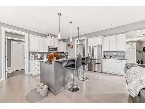 139 Coopersfield Way Sw, Airdrie, AB - Indoor Photo Showing Kitchen With Upgraded Kitchen