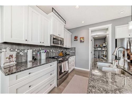 139 Coopersfield Way Sw, Airdrie, AB - Indoor Photo Showing Kitchen With Upgraded Kitchen