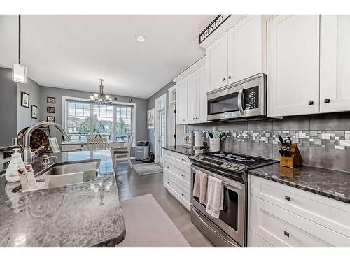 139 Coopersfield Way Sw, Airdrie, AB - Indoor Photo Showing Kitchen With Double Sink With Upgraded Kitchen