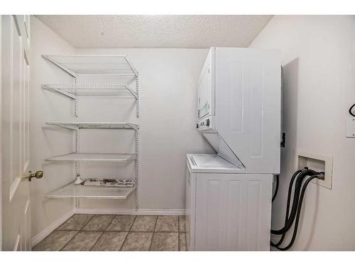 1106-7451 Springbank Boulevard Sw, Calgary, AB - Indoor Photo Showing Laundry Room