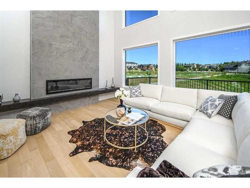 343 Spring Creek Circle Sw, Calgary, AB - Indoor Photo Showing Living Room With Fireplace