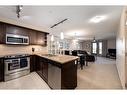 2305-310 Mckenzie Towne Gate Se, Calgary, AB  - Indoor Photo Showing Kitchen With Stainless Steel Kitchen With Double Sink With Upgraded Kitchen 