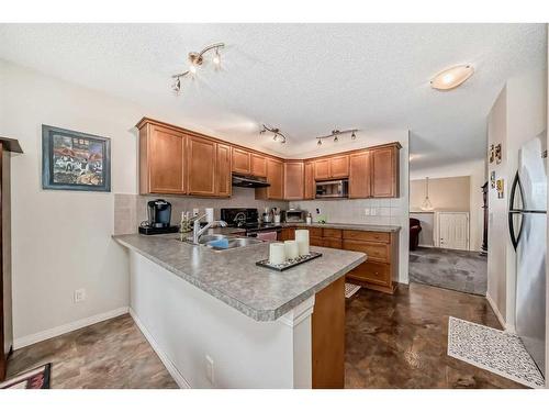 350 Ranch Ridge Court, Strathmore, AB - Indoor Photo Showing Kitchen With Double Sink