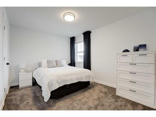 99 Ridge View Close, Cochrane, AB - Indoor Photo Showing Bedroom