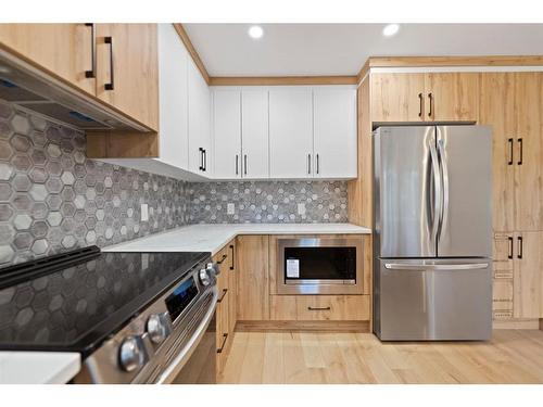 143 Wood Valley Bay Sw, Calgary, AB - Indoor Photo Showing Kitchen With Stainless Steel Kitchen With Upgraded Kitchen