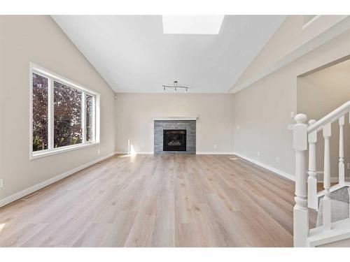 170 Tuscarora Circle Nw, Calgary, AB - Indoor Photo Showing Living Room With Fireplace