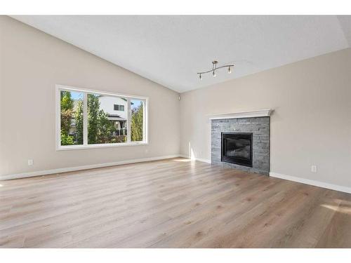 170 Tuscarora Circle Nw, Calgary, AB - Indoor Photo Showing Living Room With Fireplace