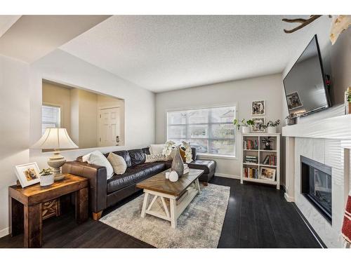 232 Copperpond Parade Se, Calgary, AB - Indoor Photo Showing Living Room With Fireplace