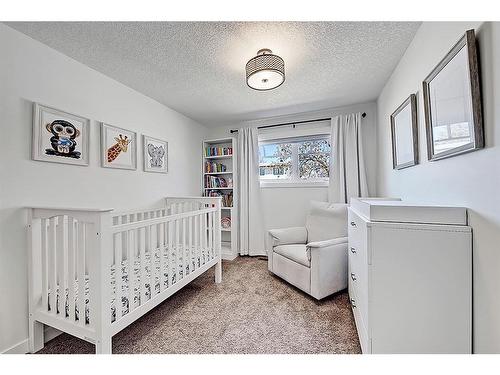 5907 Lockinvar Road Sw, Calgary, AB - Indoor Photo Showing Bedroom